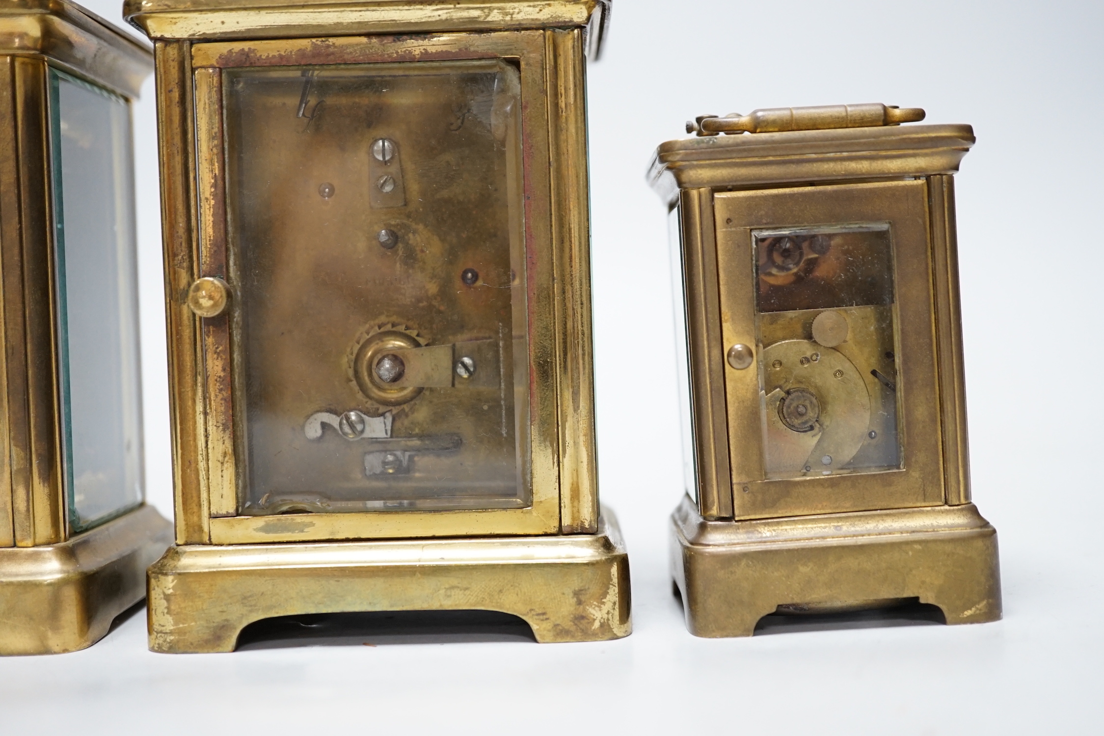 Four carriage clocks in varying sizes, tallest 12cm high